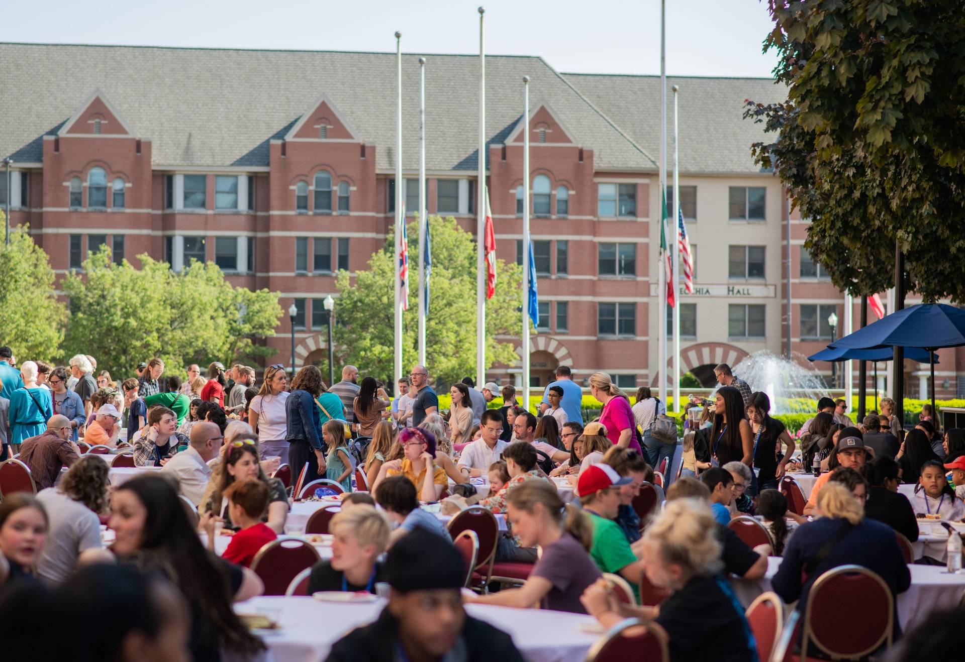 Students, teachers, community partners, and supporters enjoy the outside picnic at the showcase